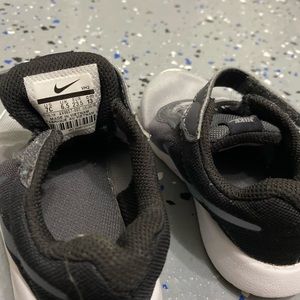 Toddler boy gray and black Nike shoes